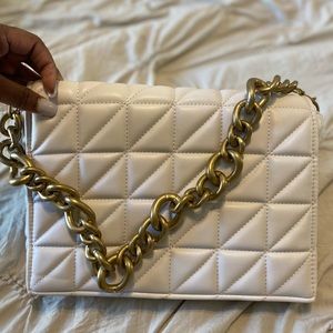 Cream colored quilted back from Zara with gold link chain strap.